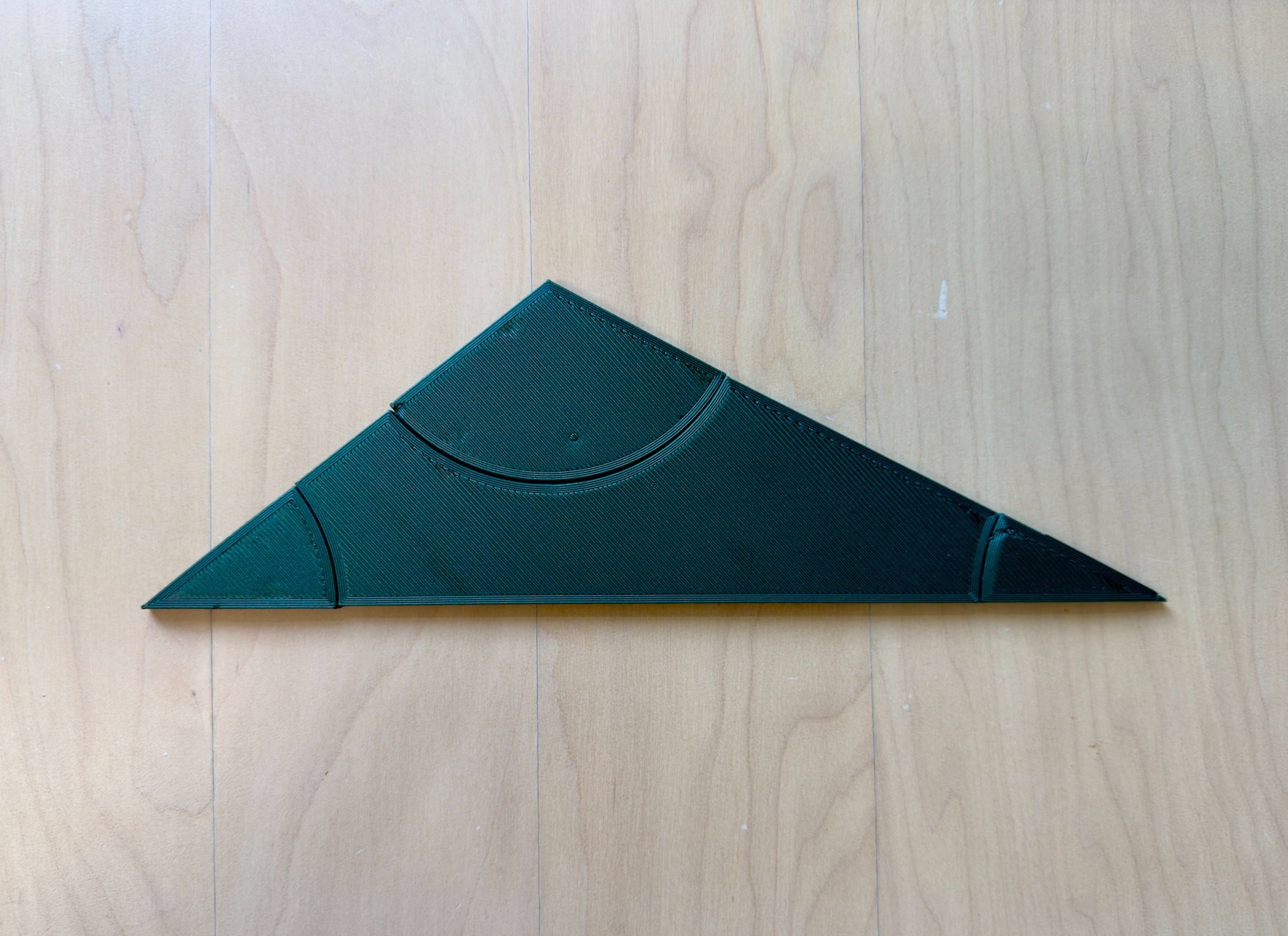 A 3D printed triangle manipulative used at Maker Math to teach geometry, shown fully assembled.